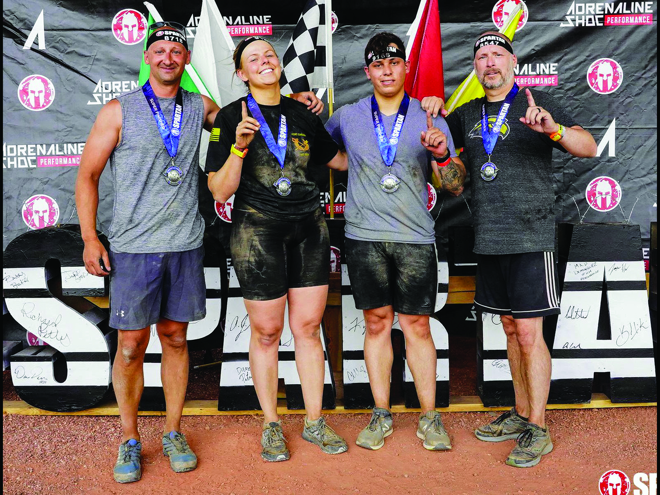 Members of the 1st Stryker Brigade Combat Team, 4th Infantry Division, Fort Carson, CO, completed the Colorado Springs Spartan Super, a 10-km obstacle course race. Pictured L to R: MAJ Jeremy Watford (Brigade Judge Advocate), CPT Ashley Jesser (Deputy Brigade Judge Advocate), SGT Matthew Pierce (2-1 CAV Paralegal), and SFC Kevin Creel (Brigade NCOIC).
